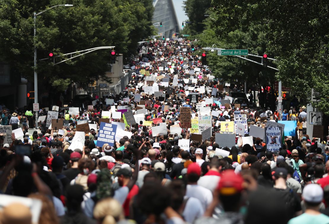 People march through the streets during a Juneteenth event Organized by the One Race Movement in Atlanta, Georgia.