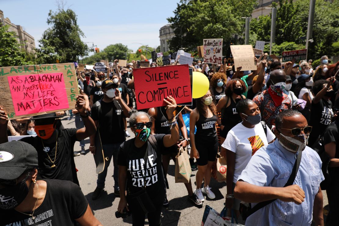 People participate in a march in Brooklyn for both Black Lives Matter and to commemorate the 155th anniversary of Juneteenth on June 19, 2020 in New York City.