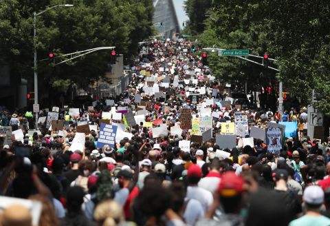 People march through the streets of Atlanta during a Juneteenth rally on June 19.