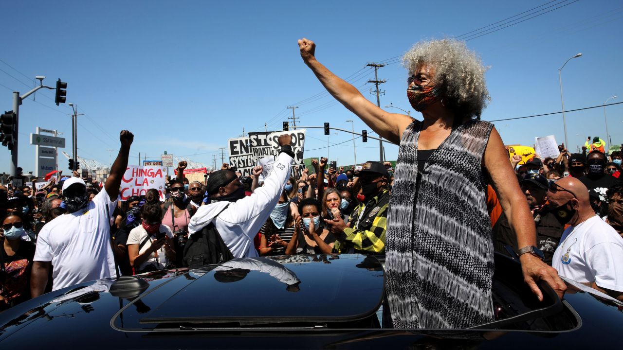 Activist Angela Davis raises her fist during a Juneteenth shutdown and protest at the Port of Oakland in California.
