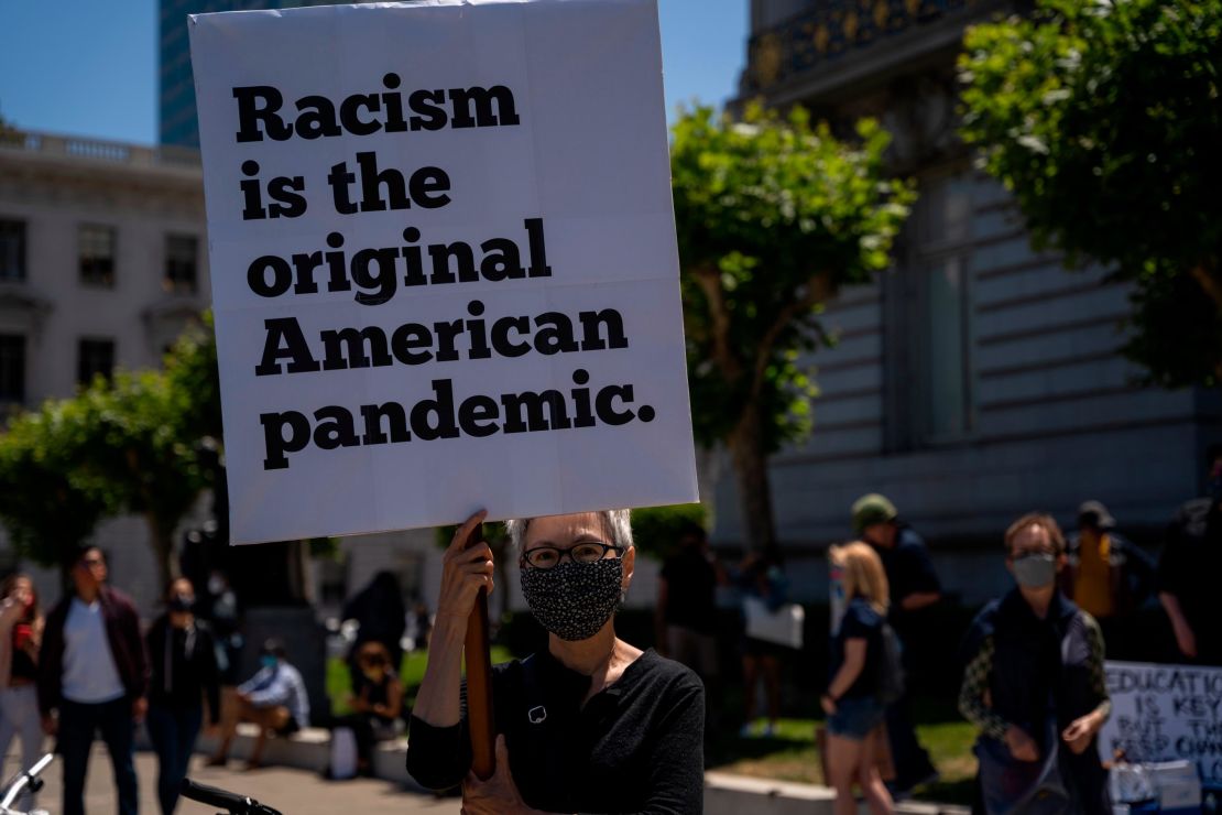 A woman holds a sign during a rally to mark Juneteenth on June 19, 2020, in San Francisco.