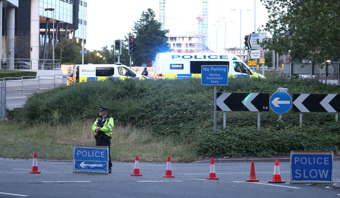 Officers near Forbury Gardens in Reading, England, where police responded to a stabbing incident on Saturday, June 20, 2020.