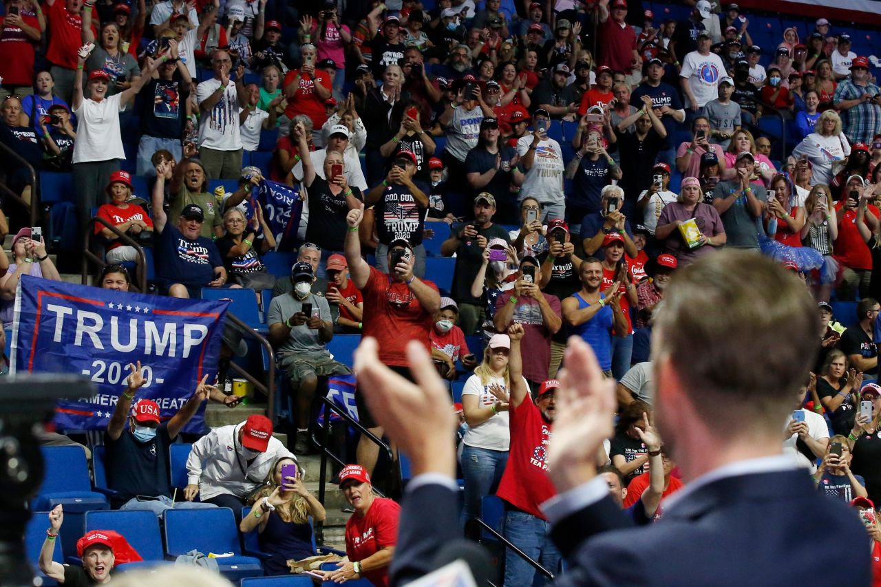 Trump supporters cheer for Trump's son Eric.