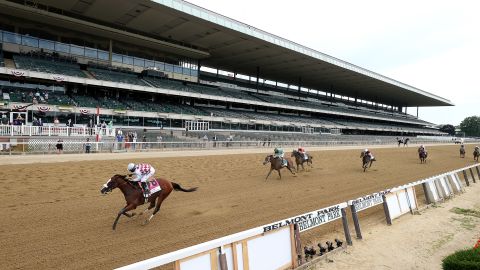 Jockey Manuel Franco rides atop Tiz the Law crossing the finish line to win the 152nd running of the Belmont Stakes  at Belmont Park on June 20, 2020 in Elmont, New York. 