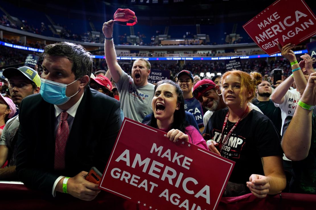 People cheer as they attend a campaign rally for President Donald Trump at the BOK Center, Saturday, June 20, in Tulsa, Oklahoma. 