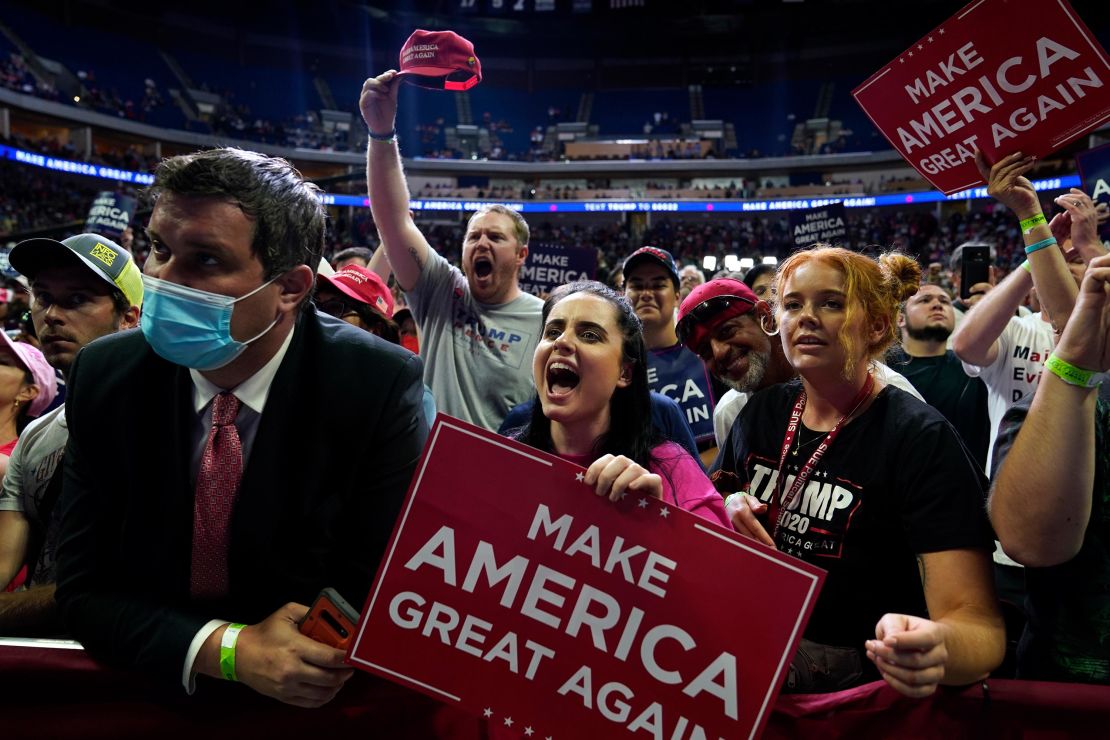 People cheer as they attend a campaign rally for President Donald Trump at the BOK Center, Saturday, June 20, in Tulsa, Oklahoma.