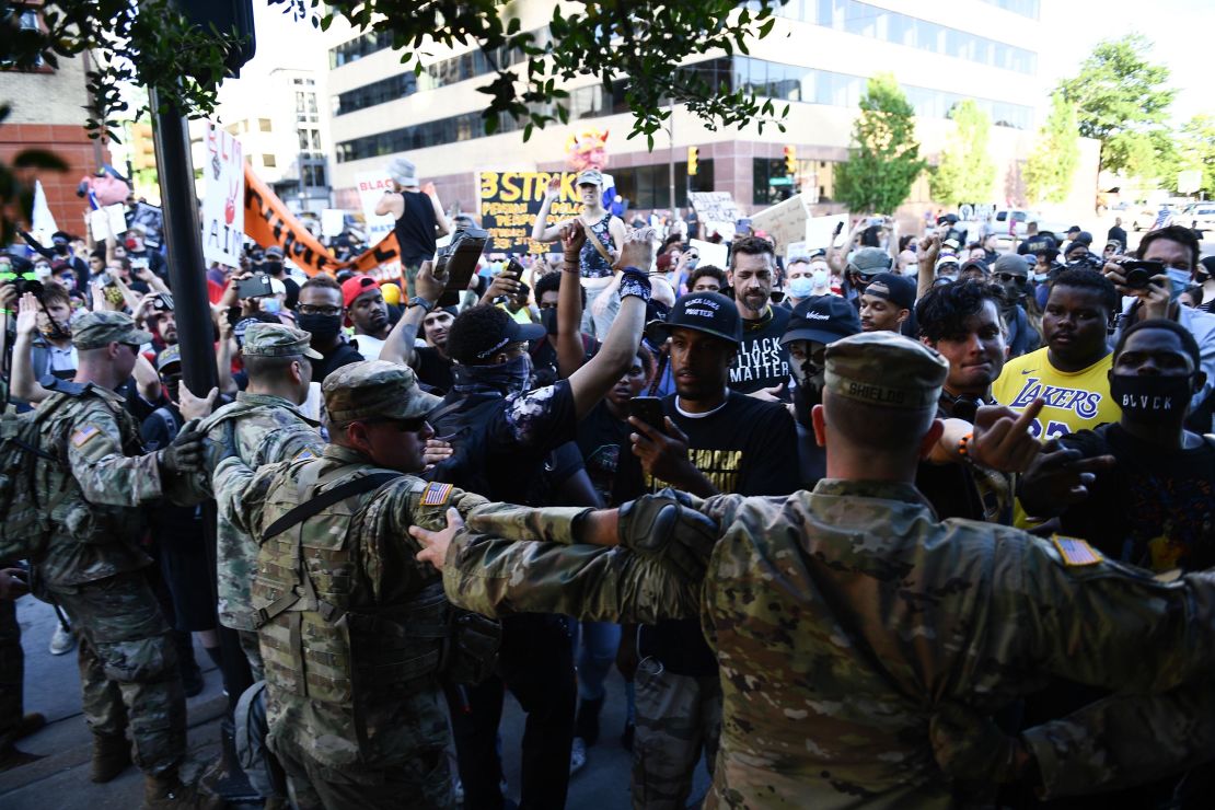 Members of the National Guard formed a barrier to stop protesters near the Bank of Oklahoma Center in Tulsa.