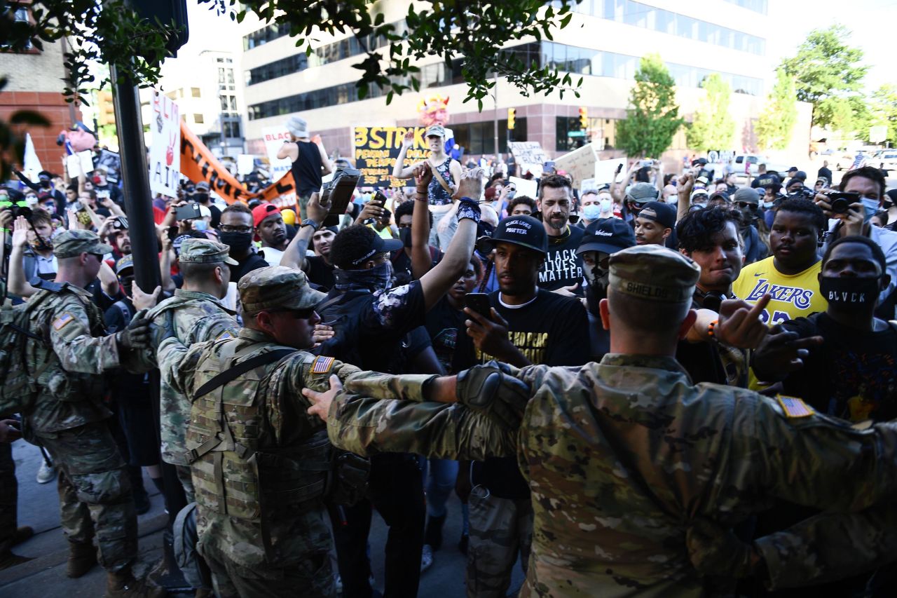 National Guardsmen form a line in front of Black Lives Matter protesters who were outside the rally on Saturday.