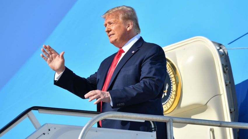 US President Donald Trump waves as he steps off Air Force One at Tulsa International Airport on his way to his campaign rally at the BOK Center on June 20, 2020 in Tulsa, Oklahoma. - Hundreds of supporters lined up early for Donald Trump's first political rally in months, saying the risk of contracting COVID-19 in a big, packed arena would not keep them from hearing the president's campaign message. (Photo by Nicholas Kamm / AFP) (Photo by NICHOLAS KAMM/AFP via Getty Images)
