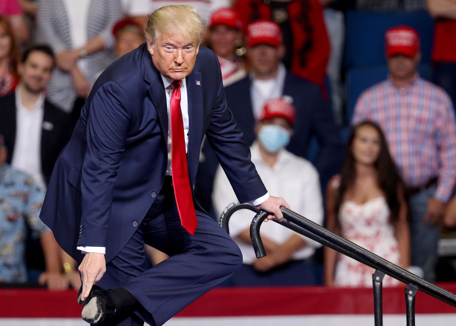Trump points to his shoe as he<a href="index.php?page=&url=https%3A%2F%2Fwww.cnn.com%2Fpolitics%2Flive-news%2Ftrump-rally-tulsa-oklahoma%2Fh_b447102cdbae2bb87ff7783ae191c872" target="_blank"> explains his careful descent down a ramp</a> earlier this month after a speech at West Point. Trump said the reason he was so careful walking down the ramp was that he was wearing "leather bottom shoes" and worried that he might slip due to the lack of traction. 