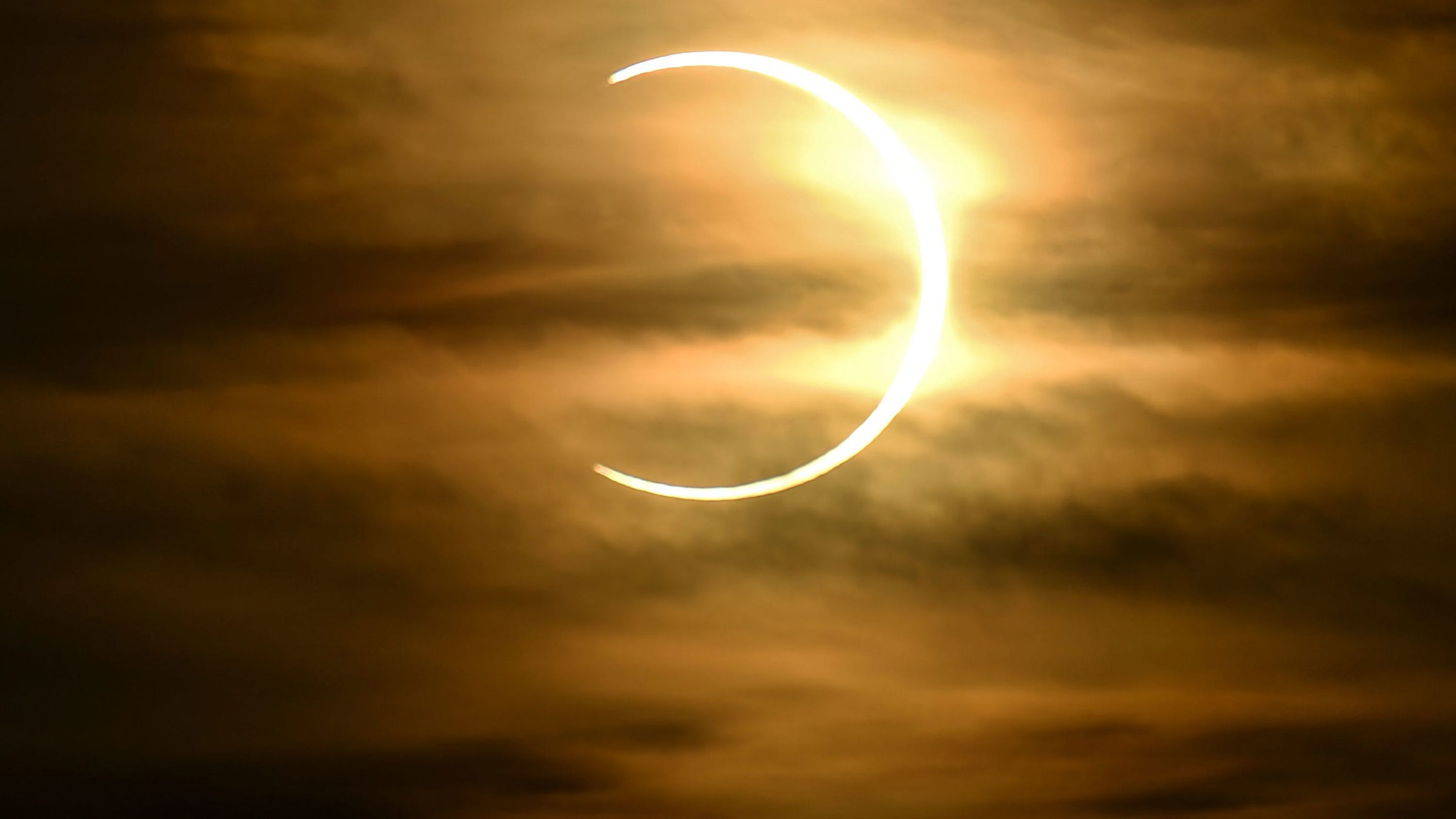 A partial solar eclipse is seen from Asan, Guam, on Sunday, June 21.