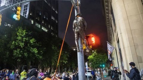 Protesters lynch a figure pulled from the Confederate monument at the State Capitol at the intersection of Salisbury and Hargett Streets in Raleigh, N.C.