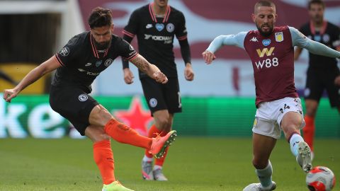 Chelsea's French striker Olivier Giroud scores his team's winning goal as his shot takes a deflection off the boot of the challenging Conor Hourihane to beat Orjan Nyland in the Aston Villa goal. 