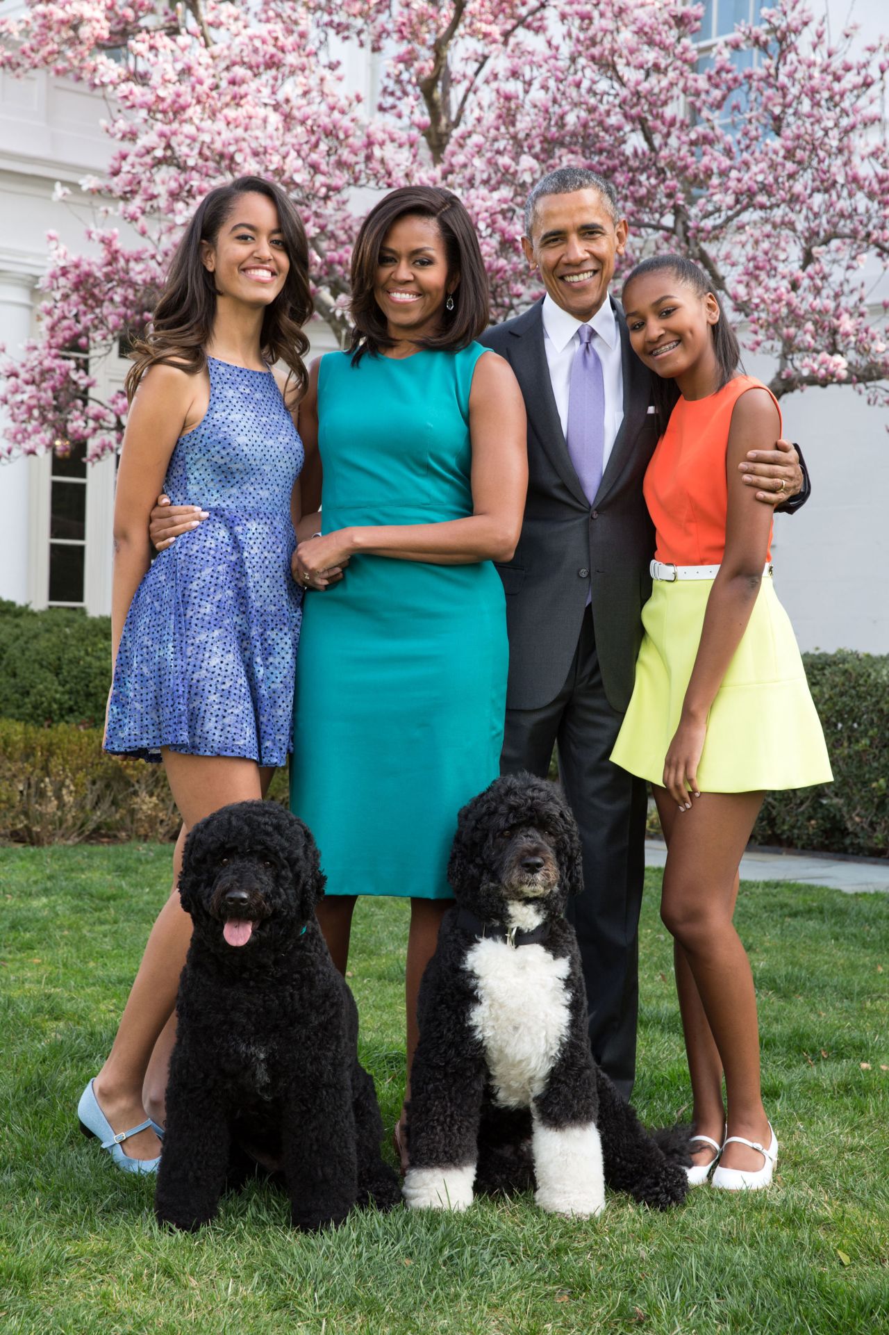 The Obama family, including daughters Malia (left) and Sasha (right), pose for a portrait with their pets Bo and Sunny in the Rose Garden on April 5, 2015.