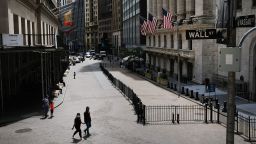 NEW YORK, NEW YORK - JUNE 15: People walk by the New York Stock Exchange (NYSE) in an empty Financial District on June 15, 2020 in New York City. Markets gained ground in afternoon trading on Monday as the Federal Reserve announced that it will begin buying individual corporate bonds in an attempt to jump start the economy after the economic setbacks from the coronavirus pandemic.  (Photo by Spencer Platt/Getty Images)