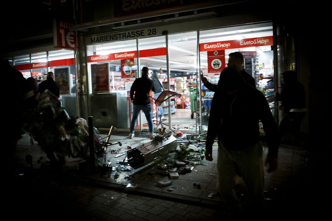 Hundreds of rioters in small groups looted stores and clashed with police in Stuttgart.