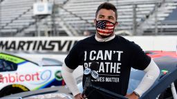 MARTINSVILLE, VIRGINIA - JUNE 10: Bubba Wallace, driver of the #43 Richard Petty Motorsports Chevrolet, wears a "I Can't Breathee - Black Lives Matter" t-shirt under his fire suit in solidarity with protesters around the world taking to the streets after the death of George Floyd on May 25, speaks to the media prior to the NASCAR Cup Series Blue-Emu Maximum Pain Relief 500 at Martinsville Speedway on June 10, 2020 in Martinsville, Virginia. (Photo by Jared C. Tilton/Getty Images)