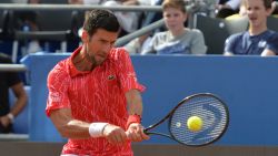 Serbia's Novak Djokovic returns the ball during an exhibition tournament in Zadar, Croatia, Sunday, June 21, 2020. Tennis player Grigor Dimitrov says he has tested positive for COVID-19 and his announcement led to the cancellation of an exhibition event in Croatia where Novak Djokovic was scheduled to play on Sunday. (AP Photo/Zvonko Kucelin)