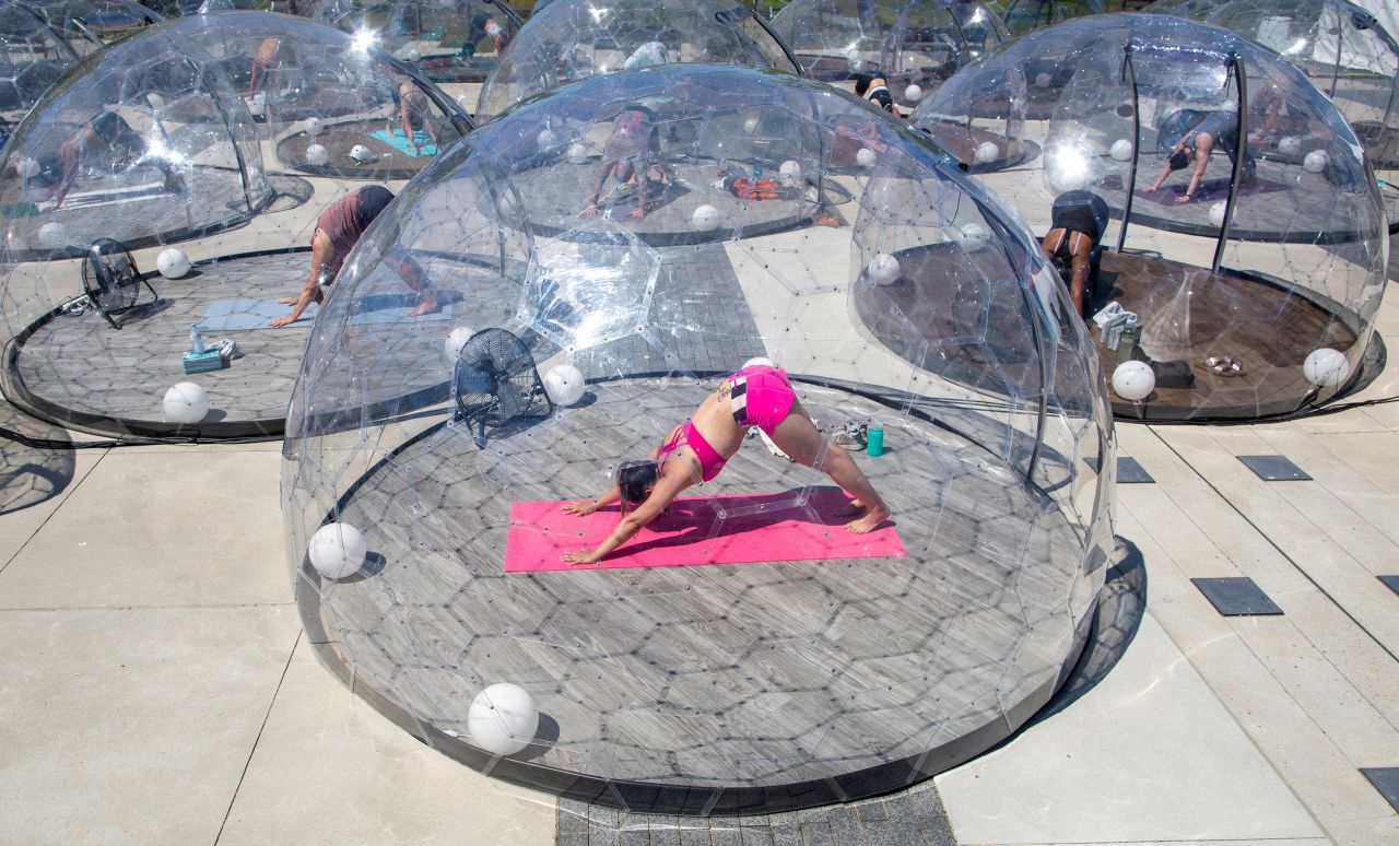 People participate in an outdoor yoga class in Toronto on June 21.