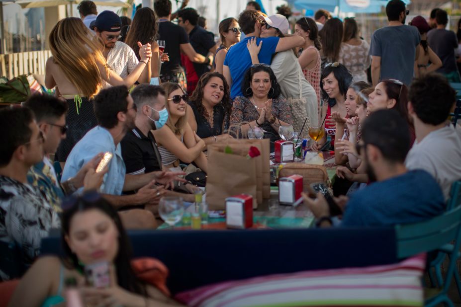 People congregate at a snack bar in Barcelona, Spain, on June 21. Spain had just lifted its national state of emergency after three months on lockdown.