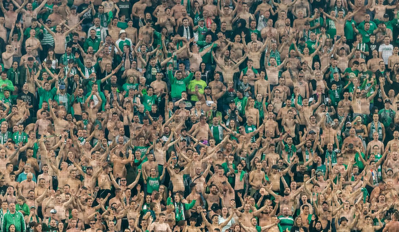 Fans of the Hungarian soccer club Ferencvarosi TC attend a match in Budapest on June 20.