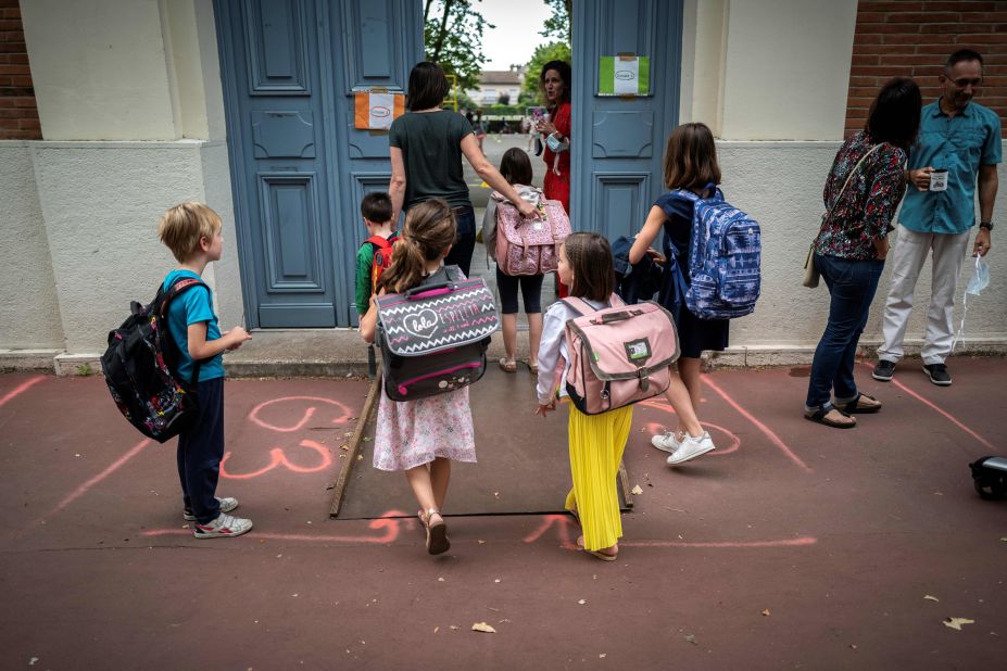 Children arrive at the Jules Julien Elementary School in Toulouse, France, on June 22.