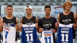 This photograph taken on June 18, 2020, shows (L/R):Croatia's Borna Coric, Bulgaria's Grigor Dimitrov, Serbia's Novak Djokovic and Germany's Alexander Zverev, tennis players as they pose for a group photograph ahead of an exhibition basketball match in Zadar. - Croatia's Borna Coric announced on June 22, 2020, that he has become the second player to test positive for coronavirus after taking part in an exhibition tournament in Croatia featuring world number one Novak Djokovic. "Hi everyone, I wanted to inform you all that I tested positive for COVID-19," the Croatian, ranked 33rd in the world, posted on Twitter. It follows the June 21, announcement by Grigor Dimitrov that he had also tested positive after pulling out of the exhibition event, which is one of the biggest since the tennis season was halted because of the pandemic. (Photo by STRINGER / AFP) / Croatia OUT (Photo by STRINGER/AFP via Getty Images)