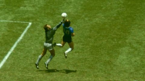 Maradona outjumps Peter Shilton to score the "Hand of God" goal in the 1986 World Cup. 
