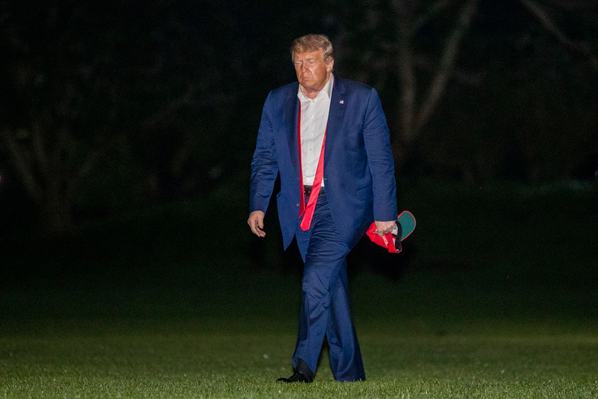 US President Donald Trump walks on the South Lawn of the White House on Sunday, June 21, <a href="https://www.cnn.com/2020/06/21/politics/trump-campaign-trail-coronavirus/index.html" target="_blank">after returning from his campaign rally</a> in Tulsa, Oklahoma.