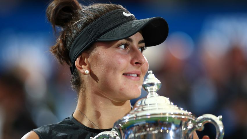 NEW YORK, NEW YORK - SEPTEMBER 07: Bianca Andreescu of Canada kisses the championship trophy during the trophy presentation ceremony after winning the Women's Singles final against Serena Williams of the United States on day thirteen of the 2019 US Open at the USTA Billie Jean King National Tennis Center on September 07, 2019 in the Queens borough of New York City. (Photo by Clive Brunskill/Getty Images)