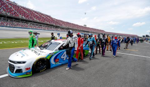 NASCAR drivers, pit crew members and others <a href="https://www.cnn.com/2020/06/22/us/nascar-race-bubba-wallace-talladega/index.html" target="_blank">show their support for Bubba Wallace</a> as they walk alongside his No. 43 car before a Cup Series race in Talladega, Alabama, on June 22. Wallace, the only Black driver in NASCAR's top circuit, has been an outspoken advocate of the Black Lives Matter movement and the corresponding protests against racism and police brutality. A noose was found in his garage stall on Sunday. The FBI investigated and concluded that the noose was a garage-door pull rope that had been in place as early as October 2019 -- well before it had been assigned to Wallace's team.