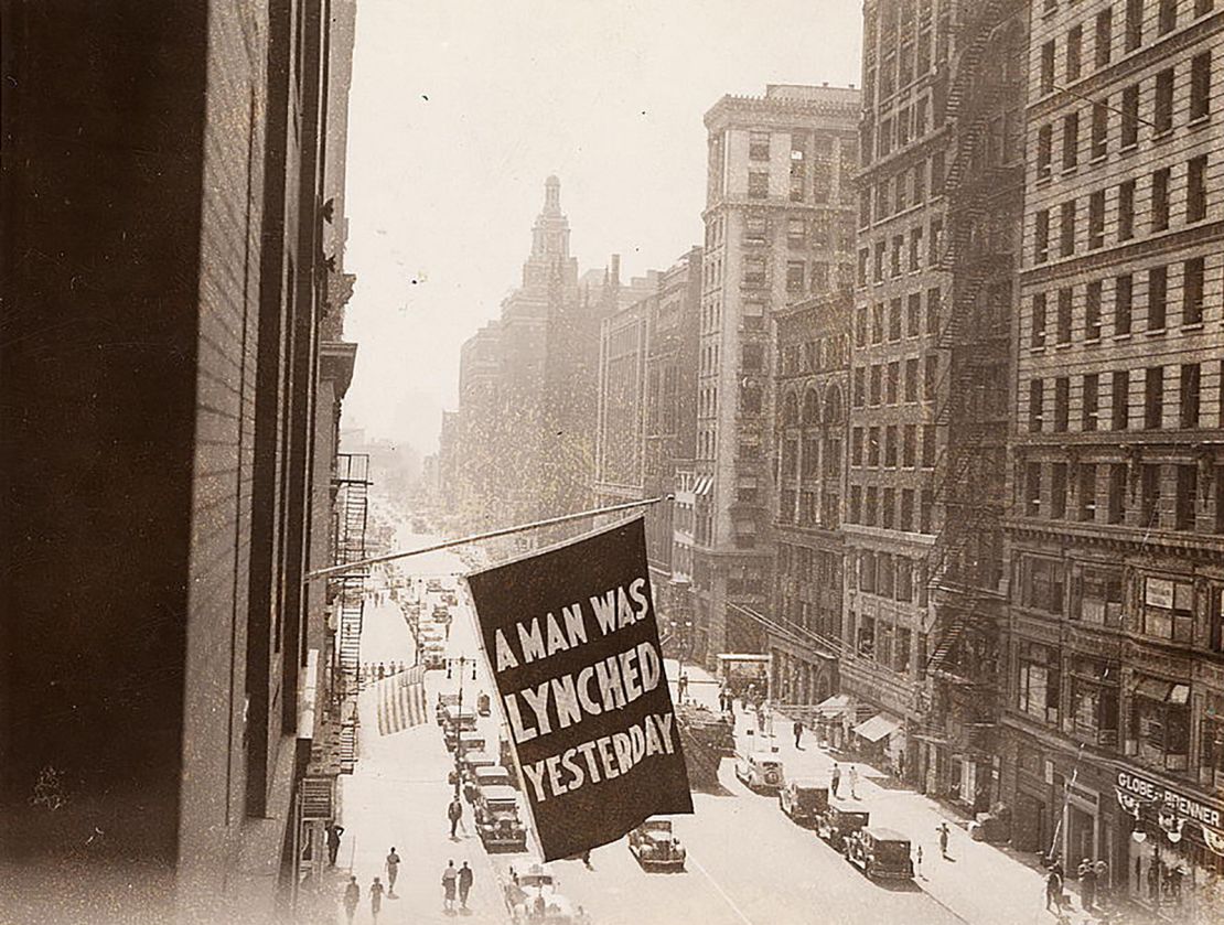 A flag announcing a lynching is flown from the window of NAACP headquarters in 1936 in New York City.