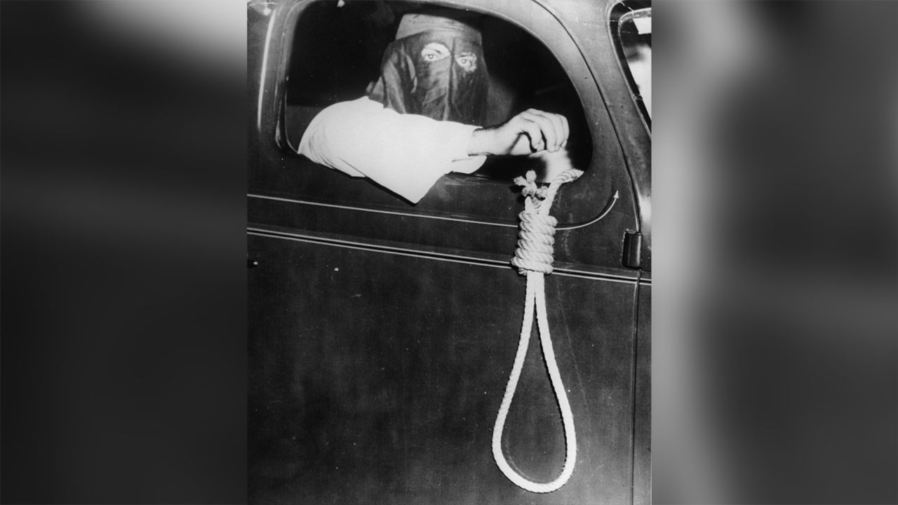 A member of the Ku Klux Klan holds a noose out a car window during a demonstration in 1939 in Miami.