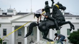 Protesters attempt to pull down the statue of Andrew Jackson in Lafayette Square near the White House on June 22, 2020 in Washington, DC. Protests continue around the country over police brutality, racial injustice and the deaths of African Americans while in police custody.