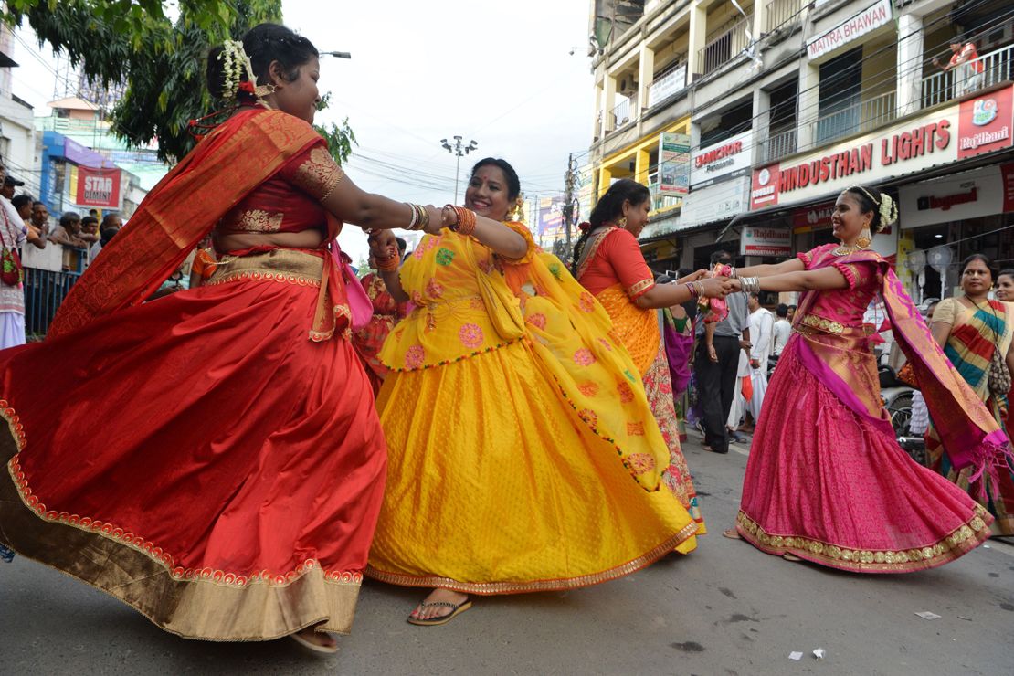 Indian devotees dance during Rath Yatra celebrations in Siliguri, West Bengal, on July 4, 2019.