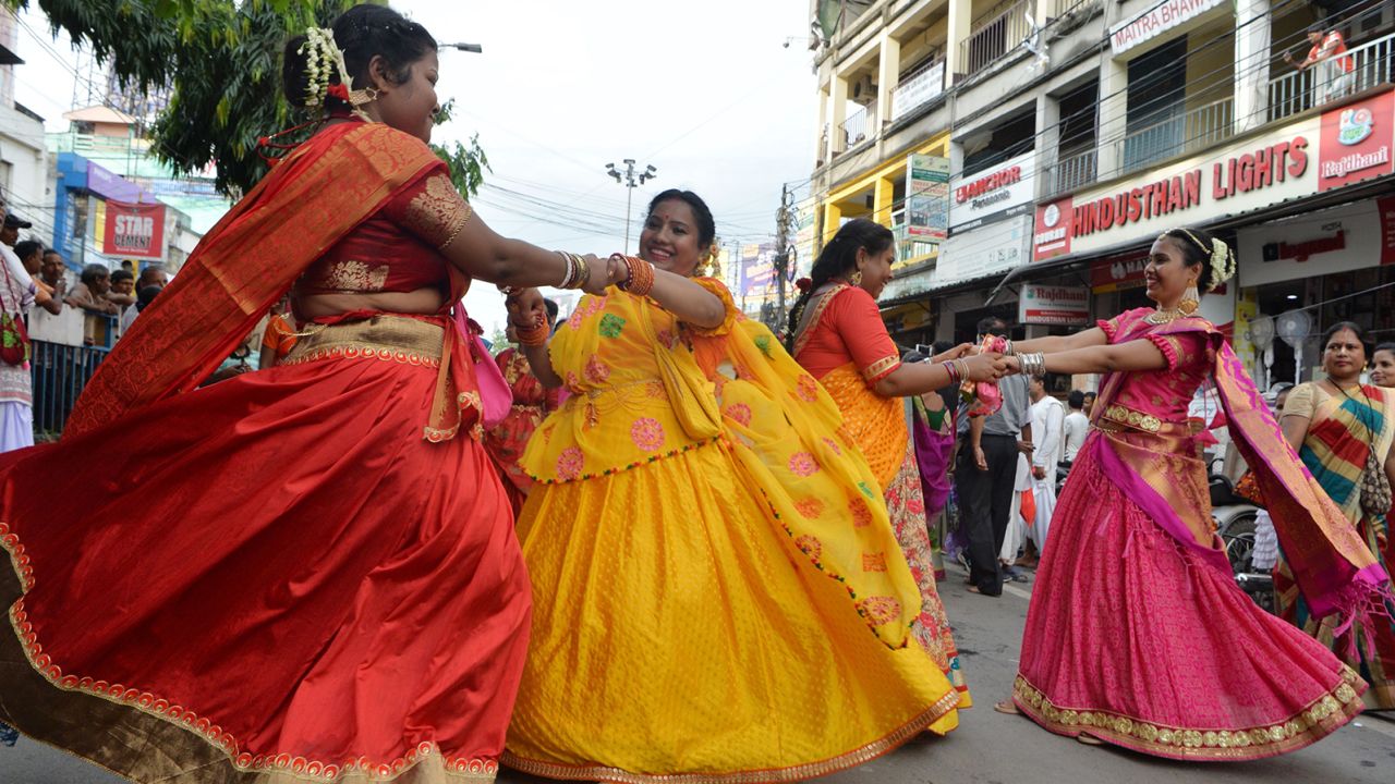 Indian devotees dance during Rath Yatra celebrations in Siliguri, West Bengal, on July 4, 2019.