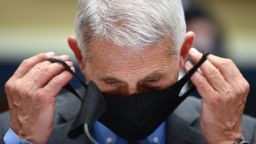 WASHINGTON, DC - JUNE 23: Dr. Anthony Fauci, director of the National Institute of Allergy and Infectious Diseases, takes off his face mask before testifying at a hearing of the U.S. House Committee on Energy and Commerce on Capitol Hill on June 23, 2020 in Washington, DC. The committee is investigating the Trump administration's response to the COVID-19 pandemic.  (Photo by Kevin Dietsch-Pool/Getty Images)