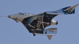 Virgin Galactic's VSS Unity comes in for a landing after its suborbital test flight on December 13, 2018, in Mojave, California. - Virgin Galactic marked a major milestone on Thursday as its spaceship made it to a peak height, or apogee, of 51.4 miles (82.7 kilometers), after taking off attached to an airplane from Mojave, California, then firing its rocket motors to reach new heights. (Photo by Gene Blevins / AFP)        (Photo credit should read GENE BLEVINS/AFP via Getty Images)