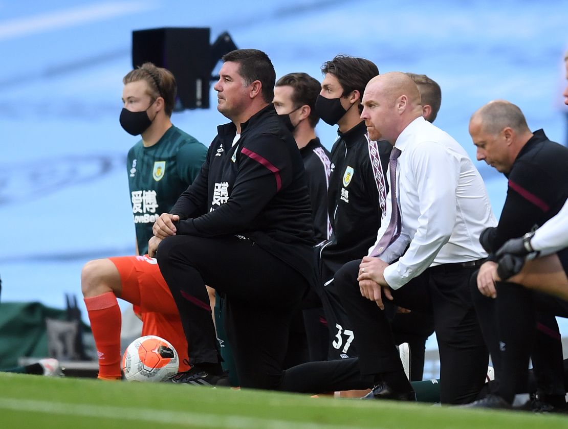 Burnley manager Sean Dyche (right) takes a knee in support of the Black Lives Matter movement.
