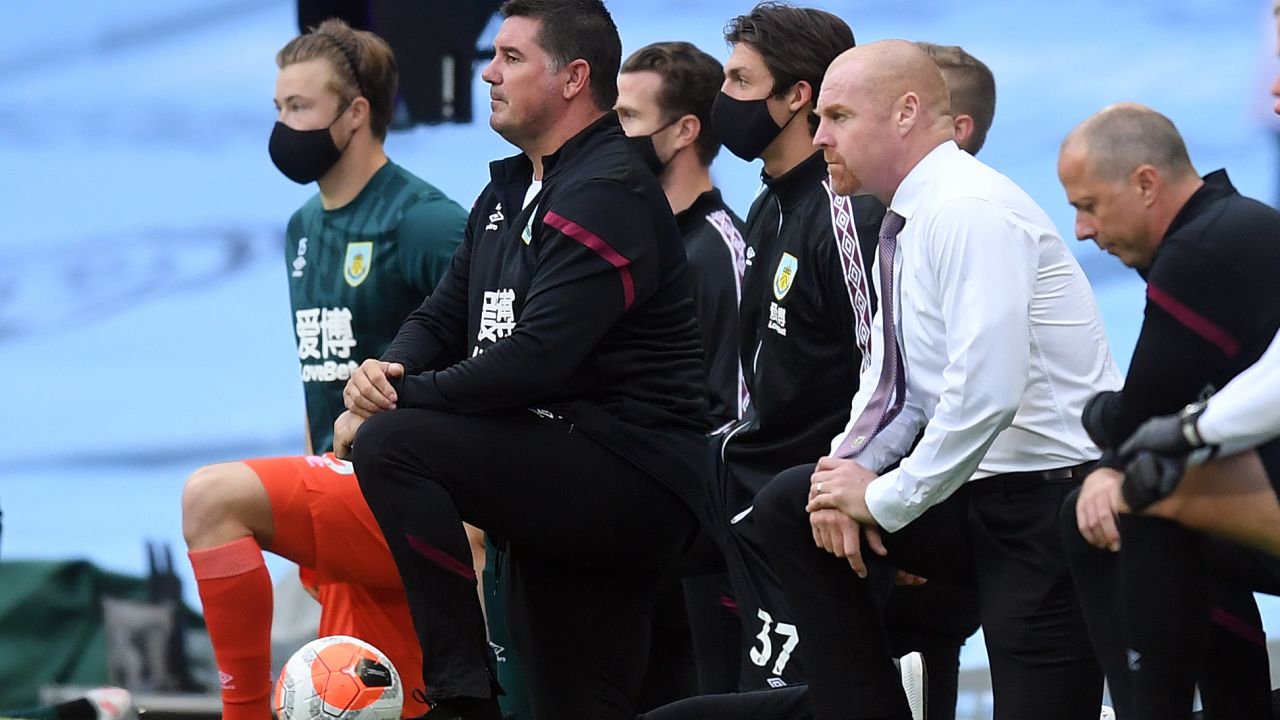Burnley manager Sean Dyche (right) takes a knee in support of the Black Lives Matter movement.