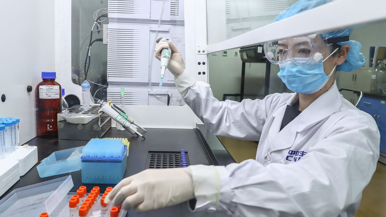 A staff member tests samples of the inactivated virus vaccine at a production plant of the China National Pharmaceutical Group in Beijing, on April 11.