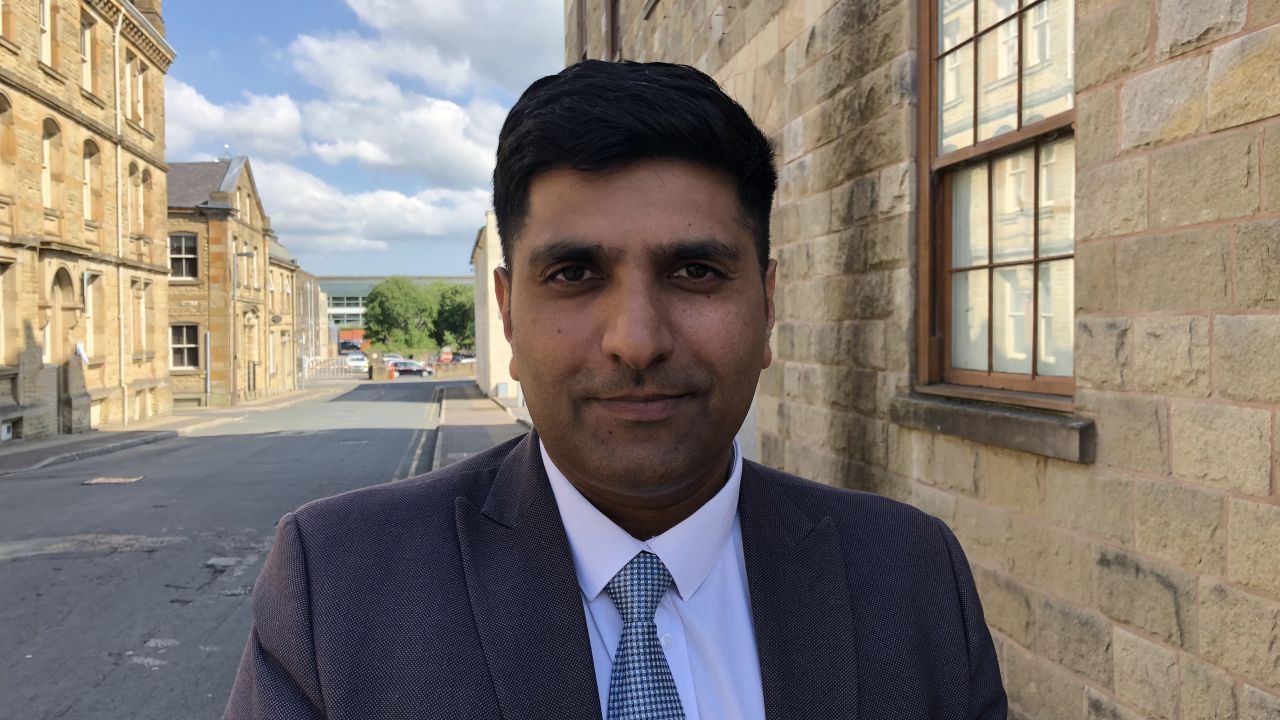 Khan says that despite the Burnley's past, it has become a "very cohesive community."