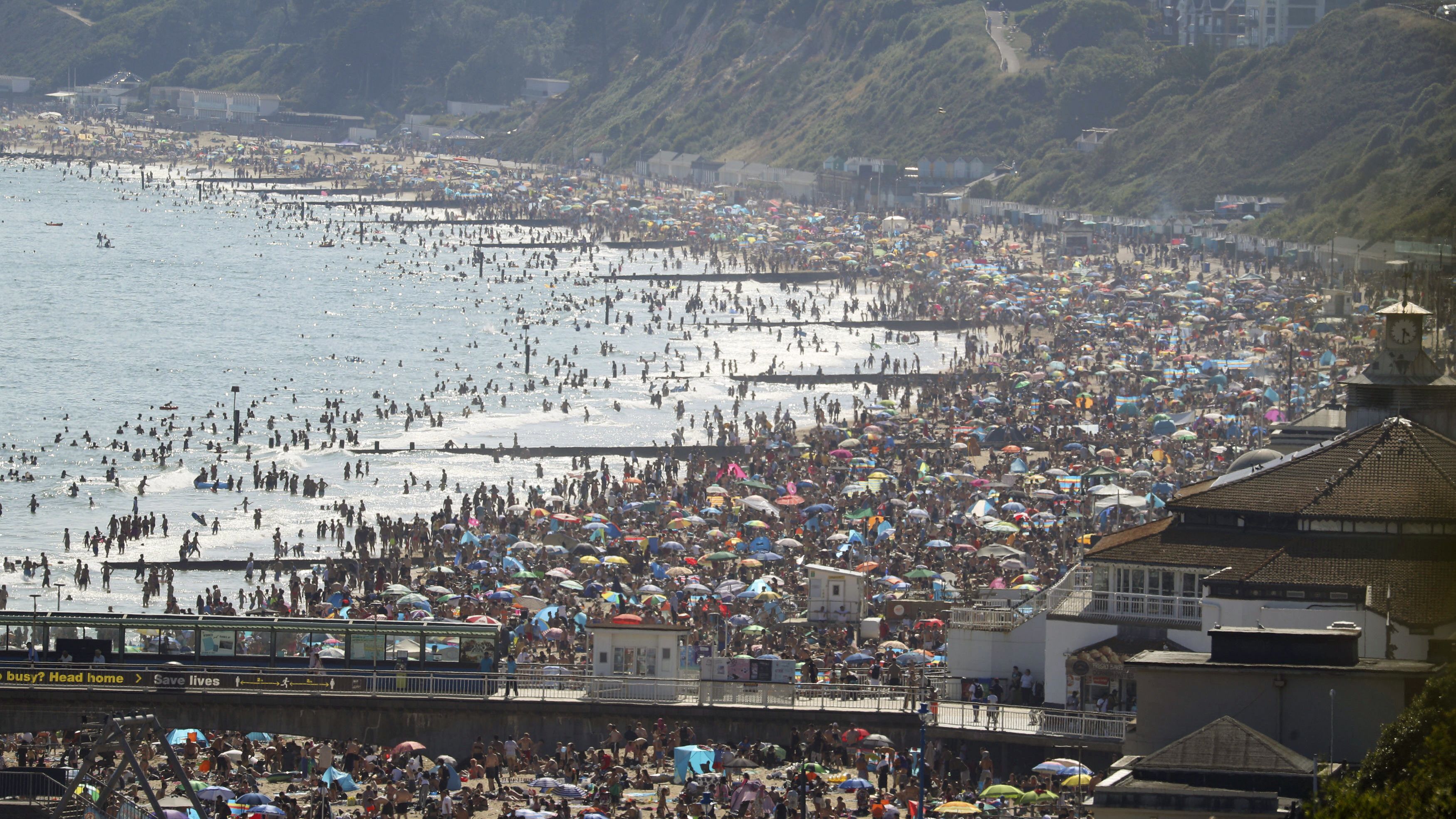 A beach is slammed with people in Bournemouth, England, on June 24. British Prime Minister Boris Johnson <a href="https://www.cnn.com/2020/05/10/uk/uk-coronavirus-lockdown-boris-johnson-gbr-intl/index.html" target="_blank">began easing coronavirus restrictions in May,</a> but people are still supposed to be distancing themselves from one another.