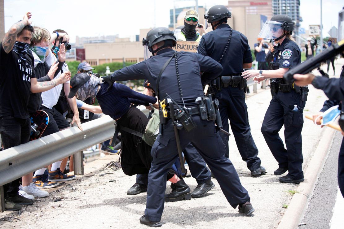 A protester in Austin, Texas, is detained during a rally against the death in Minneapolis police custody of George Floyd.