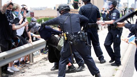 A protester in Austin, Texas, is detained during a rally against the death in Minneapolis police custody of George Floyd.