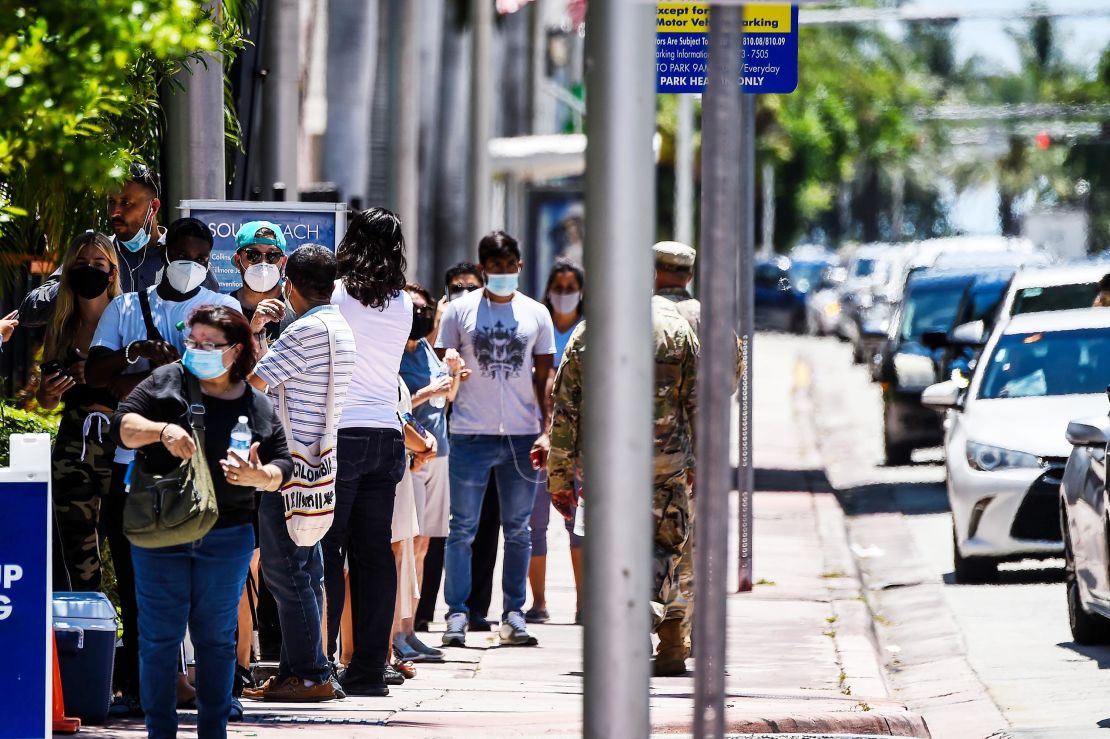 People wait in line to get tested for the coronavirus at a COVID-19 testing site in Miami Beach, Florida on Wednesday, June 24, 2020.