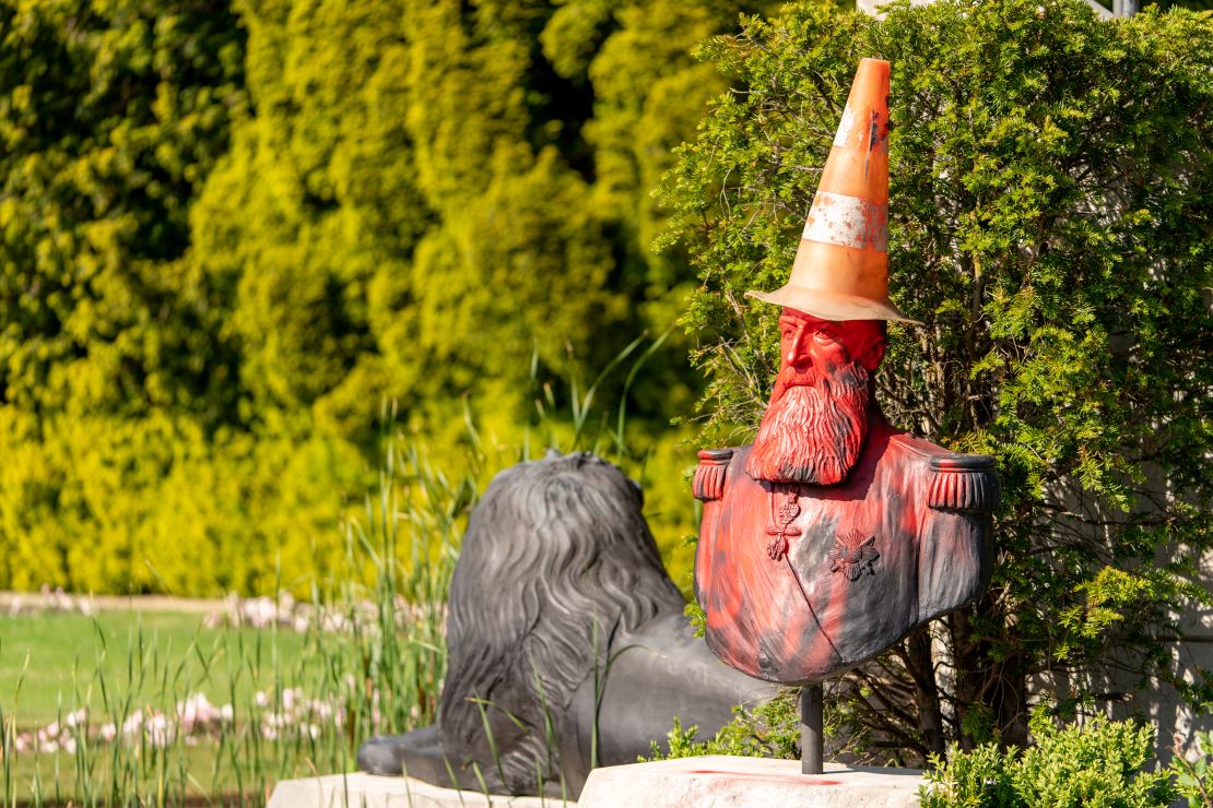 A statue in the grounds of Belgium's Royal Museum for Central Africa, featuring a bust of King Leopold II, was covered in red paint and topped with a traffic cone "dunce's cap."