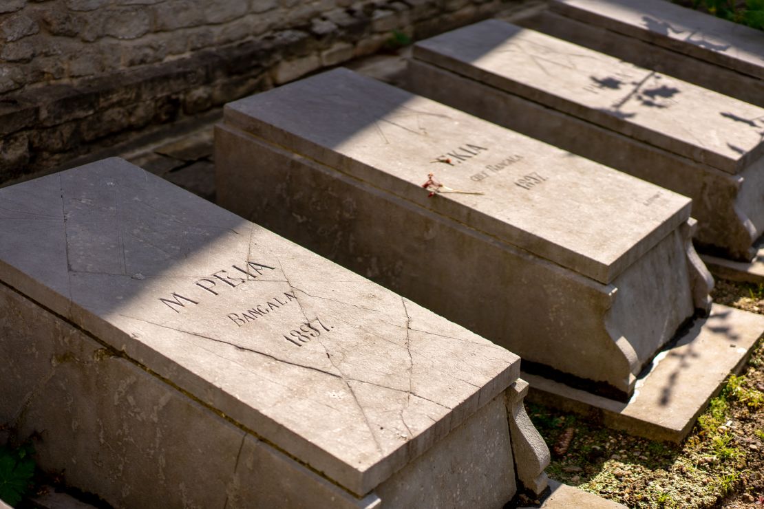 The graves of seven Congolese people brought to Belgium to be put on display in an "African village" in Brussels, which has been described as a "human zoo."