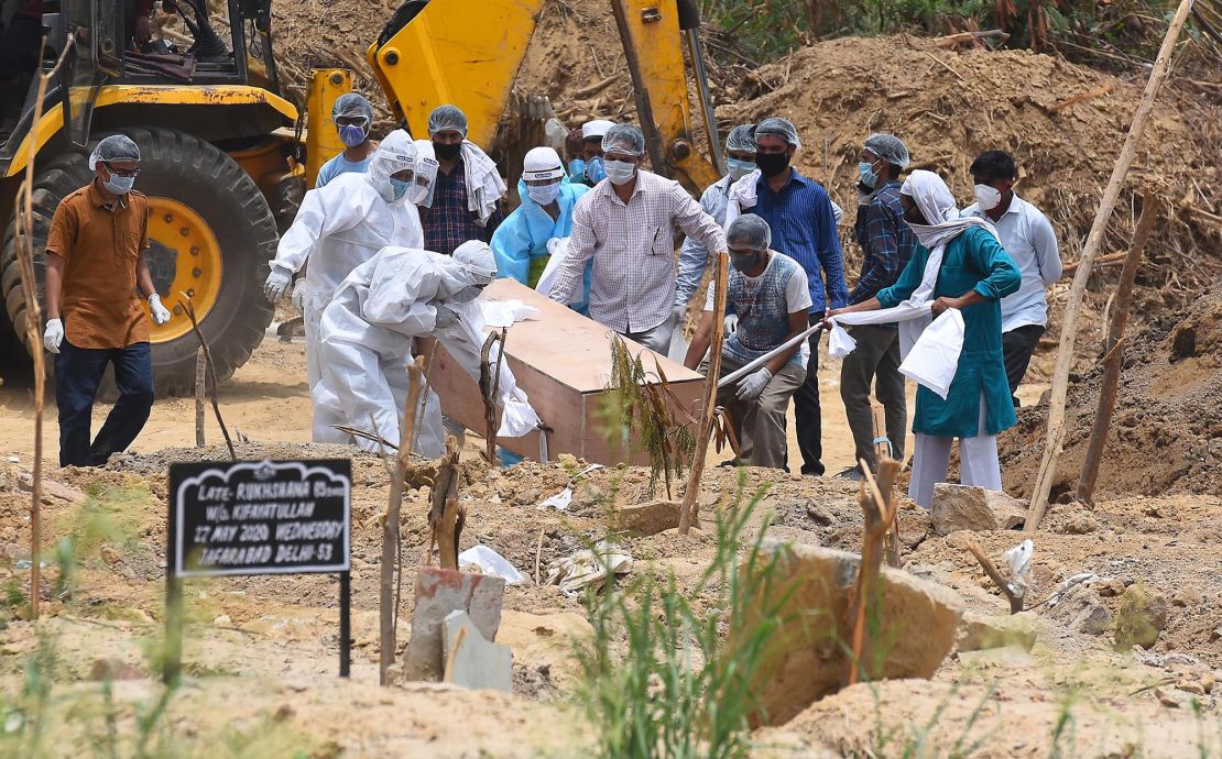 A person who died of Covid-19 is buried at Jadid Qabristan Ahle Islam graveyard, on June 19,  in New Delhi, India.  