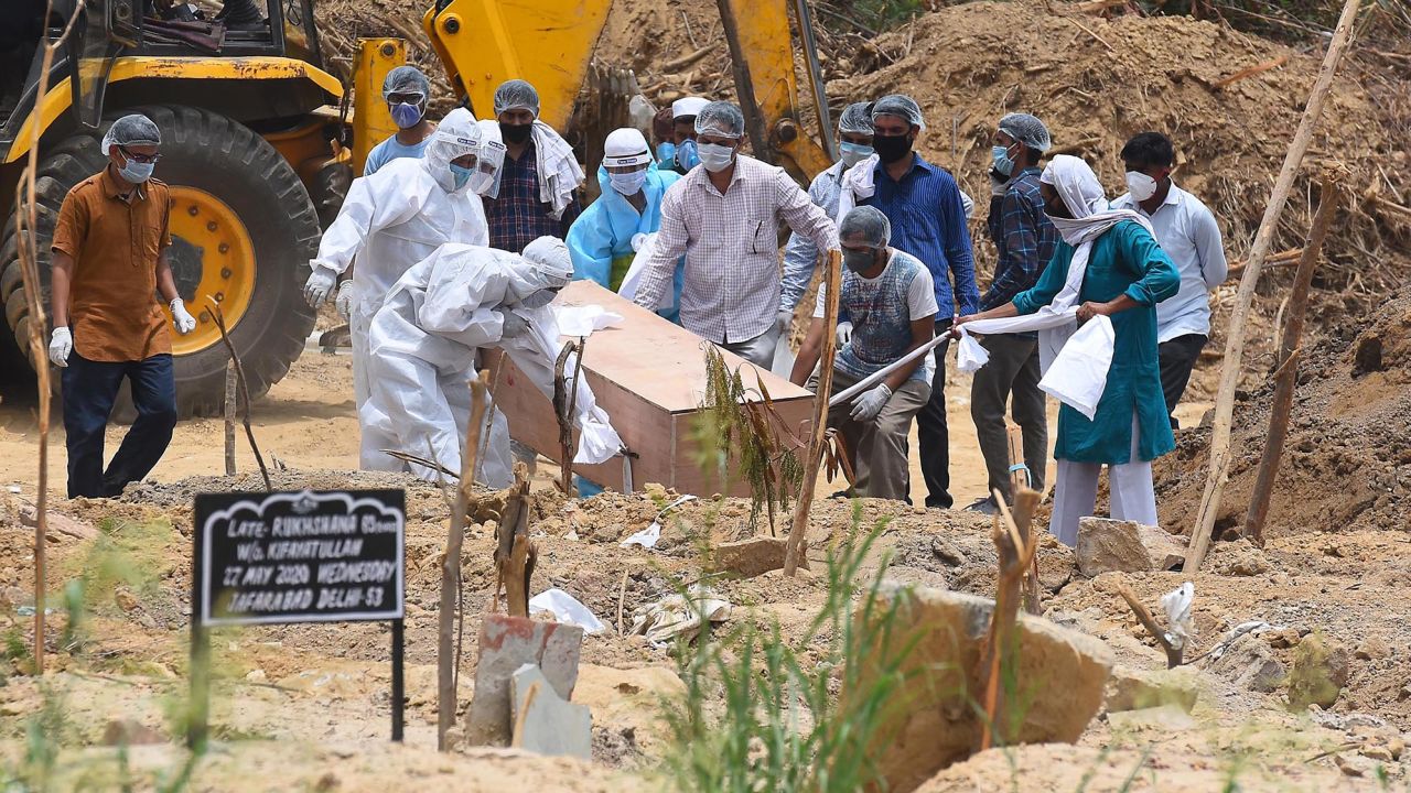 A person who died of Covid-19 is buried at Jadid Qabristan Ahle Islam graveyard, on June 19,  in New Delhi, India.  